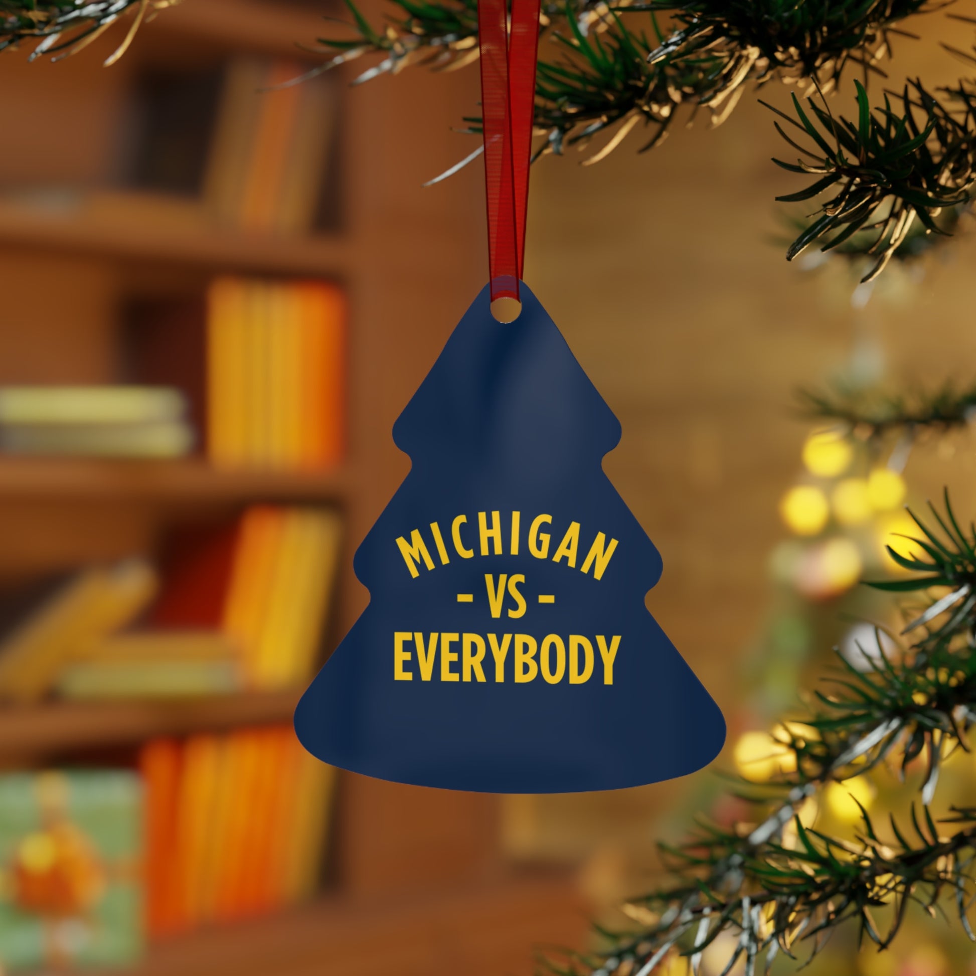 Michigan vs Everyone Ornaments. Four styles to choose from; Round, Oval, Christmas Tree and Bell. Front says Michigan vs Everyone, back says GO BLUE